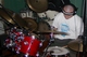 Rickie readies the acoustic drum set